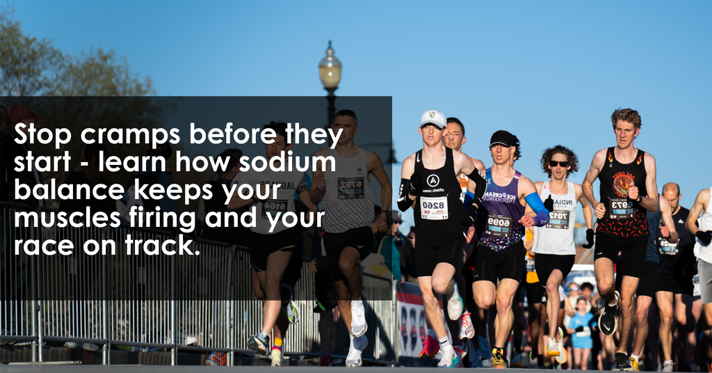 Runners racing in sunlight with text overlay about preventing cramps through proper sodium balance and hydration strategies